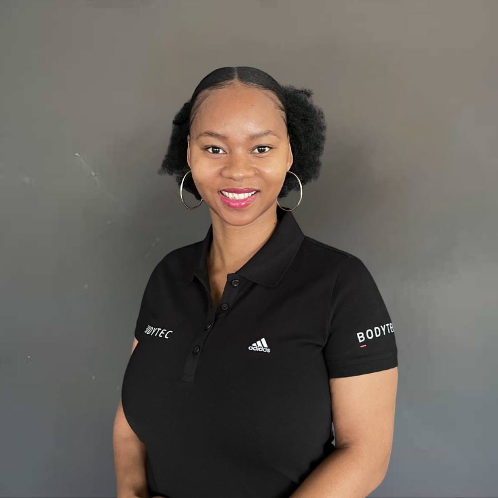 A black female studio owner smiling